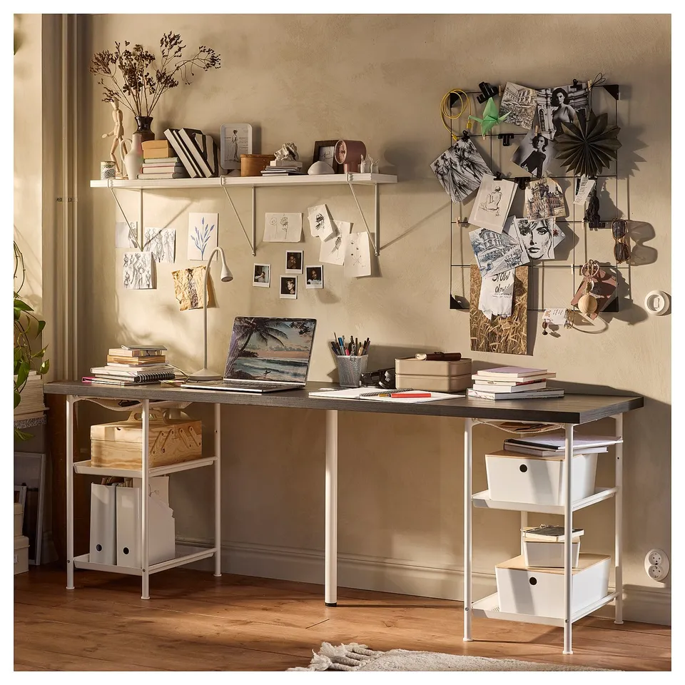 LAGKAPTEN desk setup with shelves, honeycomb top, white legs, laptop, books, decor.