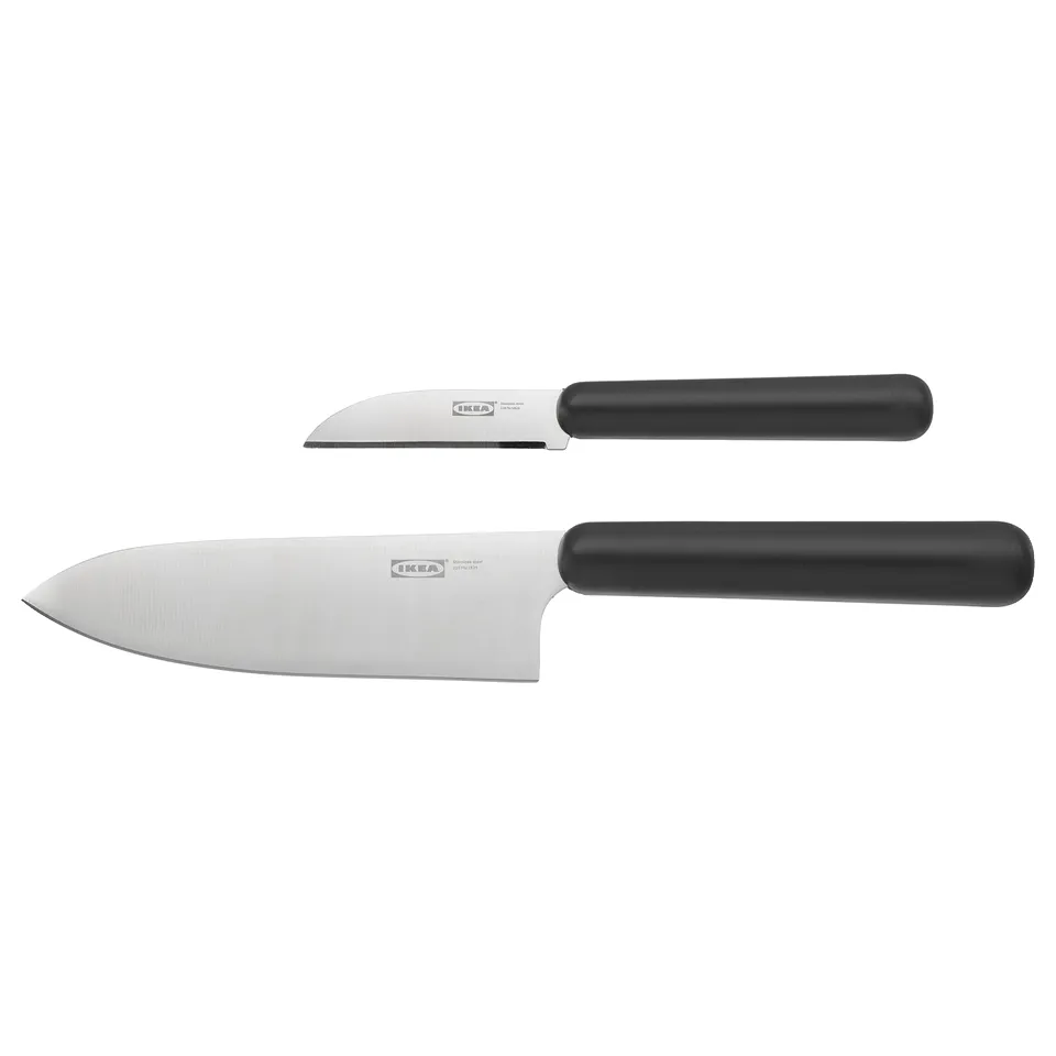 Displays two kitchen knives by IKEA, featuring sharp, stainless steel blades and black polypropylene handles for a secure grip.