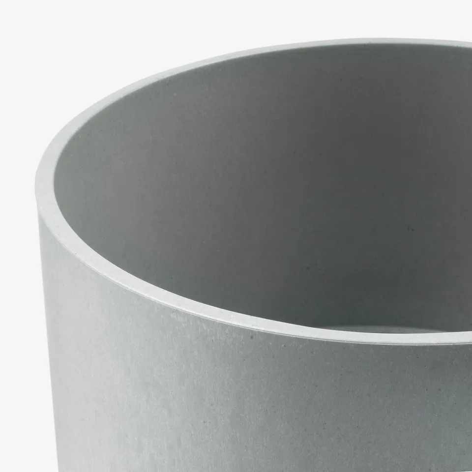 Large cylindrical planter, made of recycled plastic, textured surface, neutral grey tone.