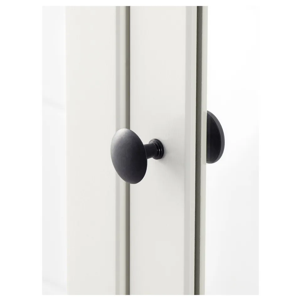 A sleek, black door handle mounted on a quality white door, designed to be both functional and stylish.