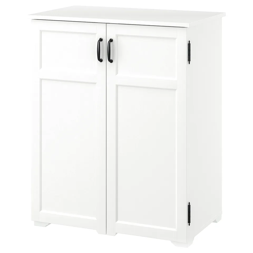 A white GREÅKER cabinet with two doors, featuring traditional design, black handles, and storage compartments.