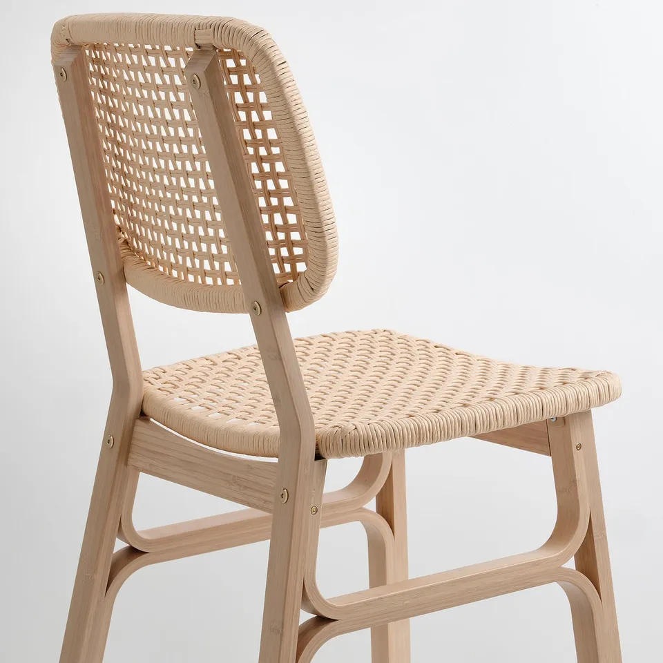 Woven bamboo chair with intricate seat and back patterns, combining natural beauty and sturdy craftsmanship.