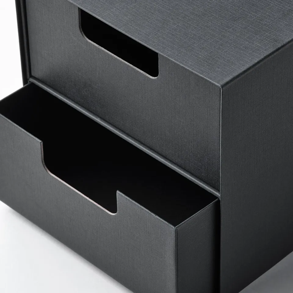 Black 3-drawer chest with cut-out handles, recycled.