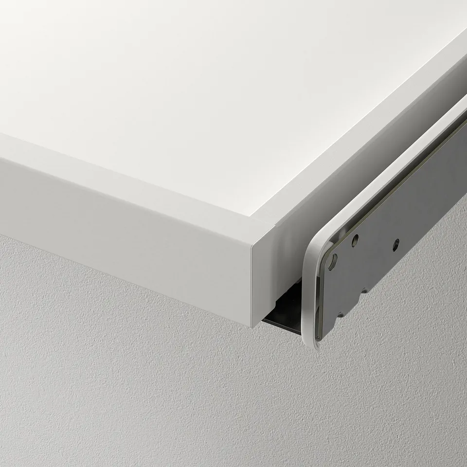 Close-up of white drawers underside, showing metal glide mechanism. Highlights smooth movement and quality.