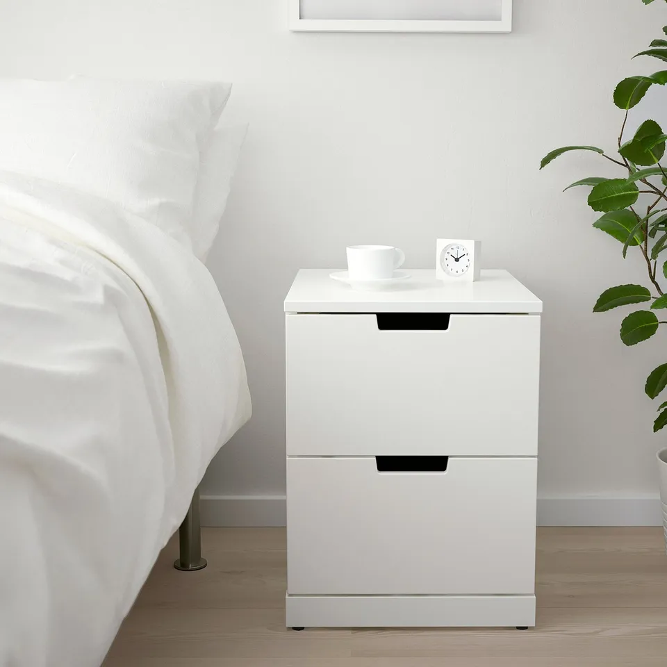 NORDLI chest of 2 drawers beside bed, minimalist design.