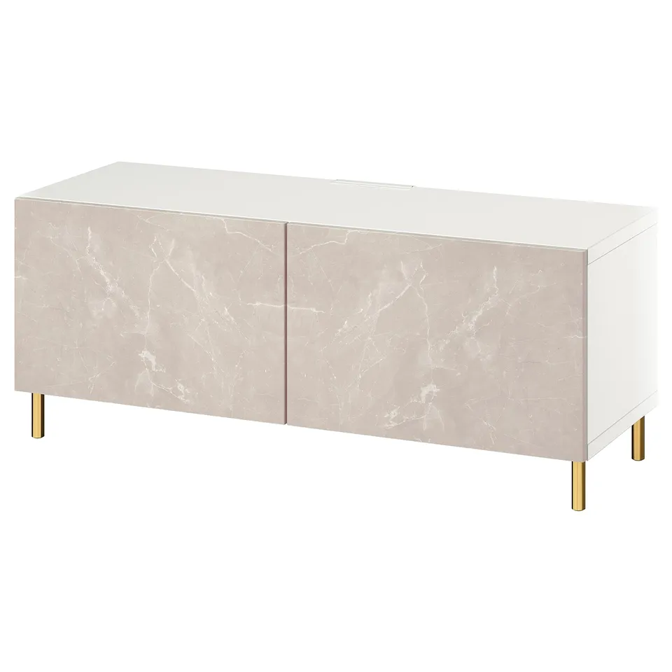 A white BESTÅ tv bench with marble-patterned doors and gold legs.