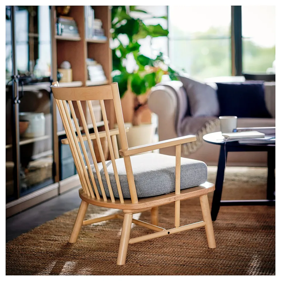 PERSBOL chair, light wood & grey cushion. Classic design, comfortable, fits tight spots. Near shelves, couch, plants.