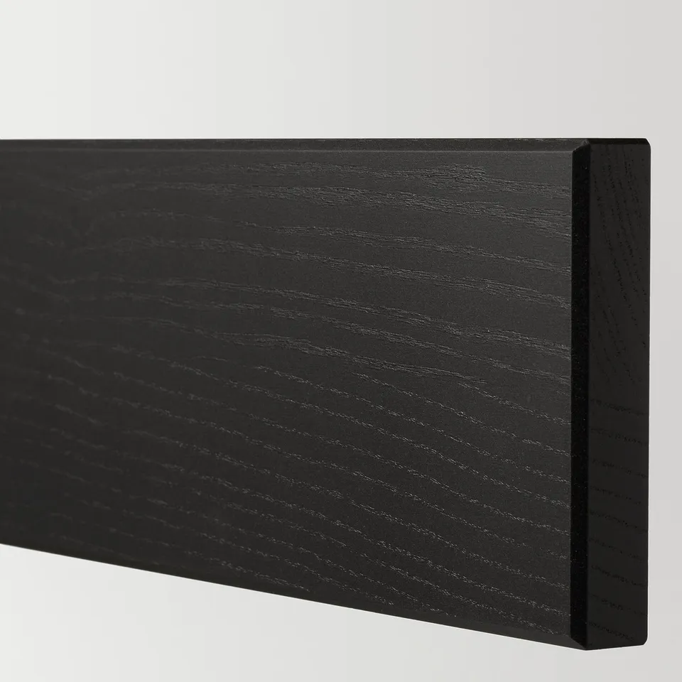 Black wooden panel with smooth finish and bevelled edges, showcasing high-quality craftsmanship.