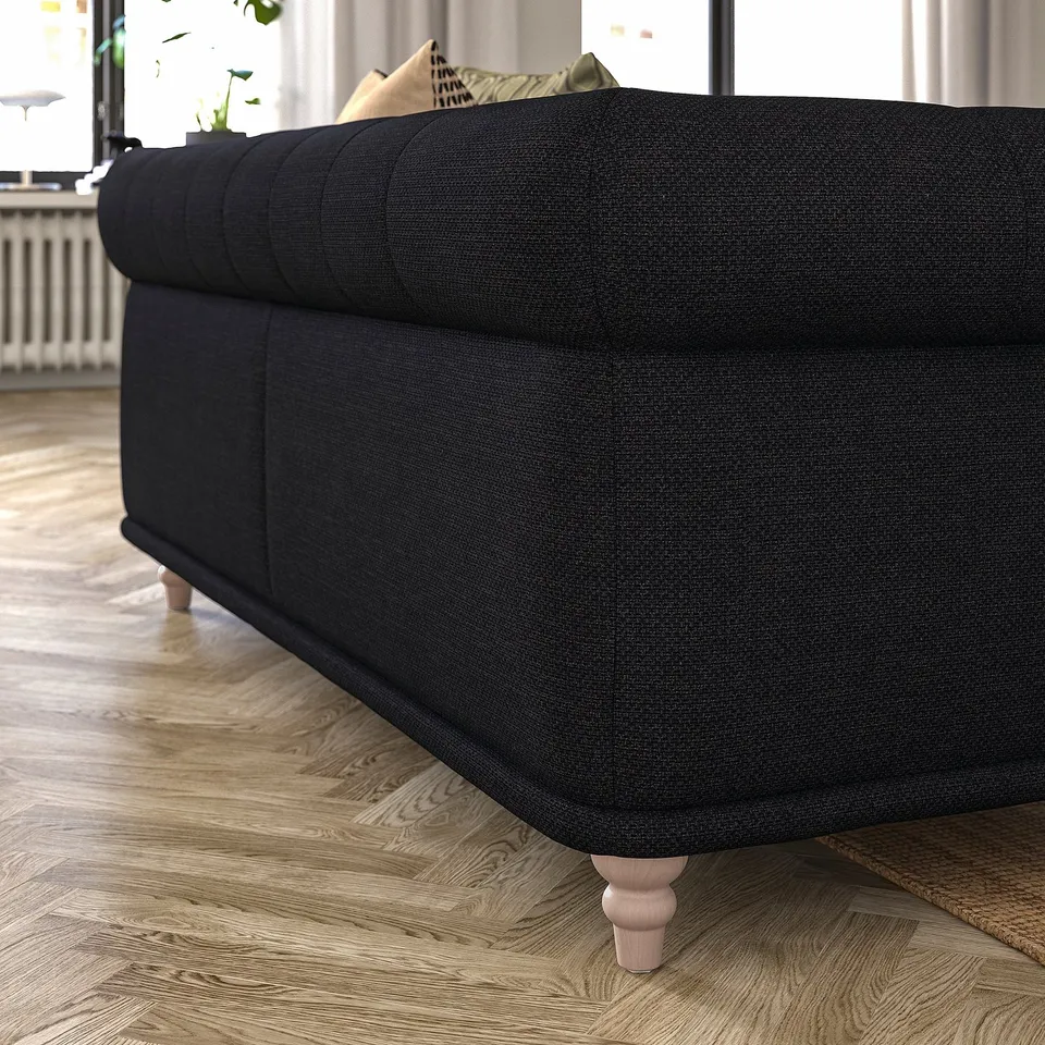 Dark grey VISKAFORS sofa, classic design, soft rounded shapes, wooden legs.