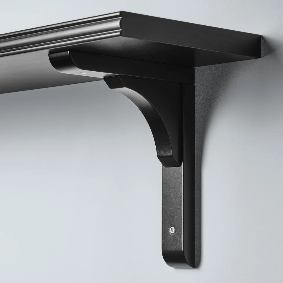 Black metal shelf bracket securely attached to a wall, suitable for both 20cm and 30cm deep shelves.