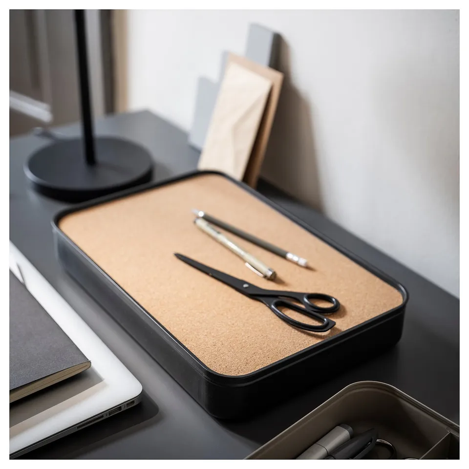 Tidy desk with HARVMATTA box, scissors, pens, lamp, laptop