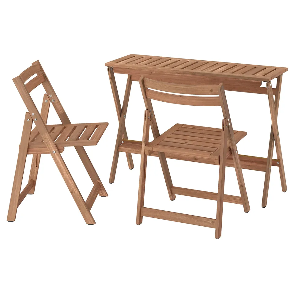 NÄMMARÖ wooden outdoor table and two folding chairs, light brown, with a sturdy and simple design.