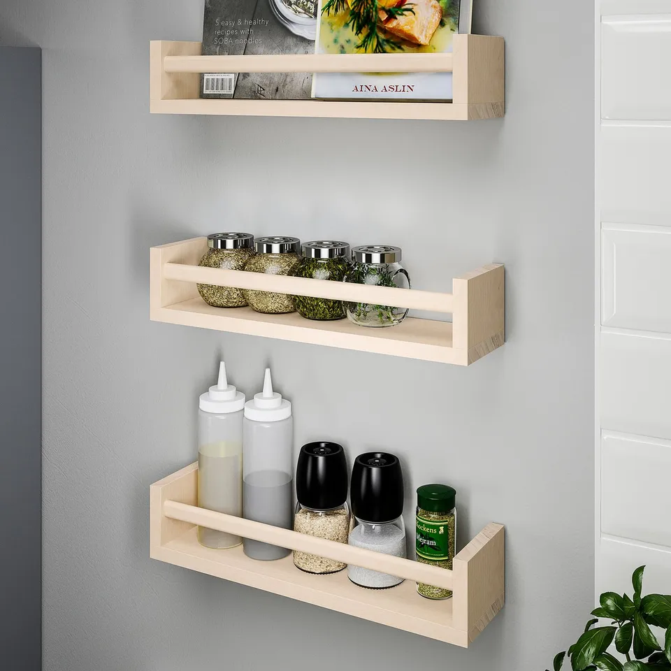 Three wooden shelves with kitchen items: books, herbs, spices, condiments, and grinders.