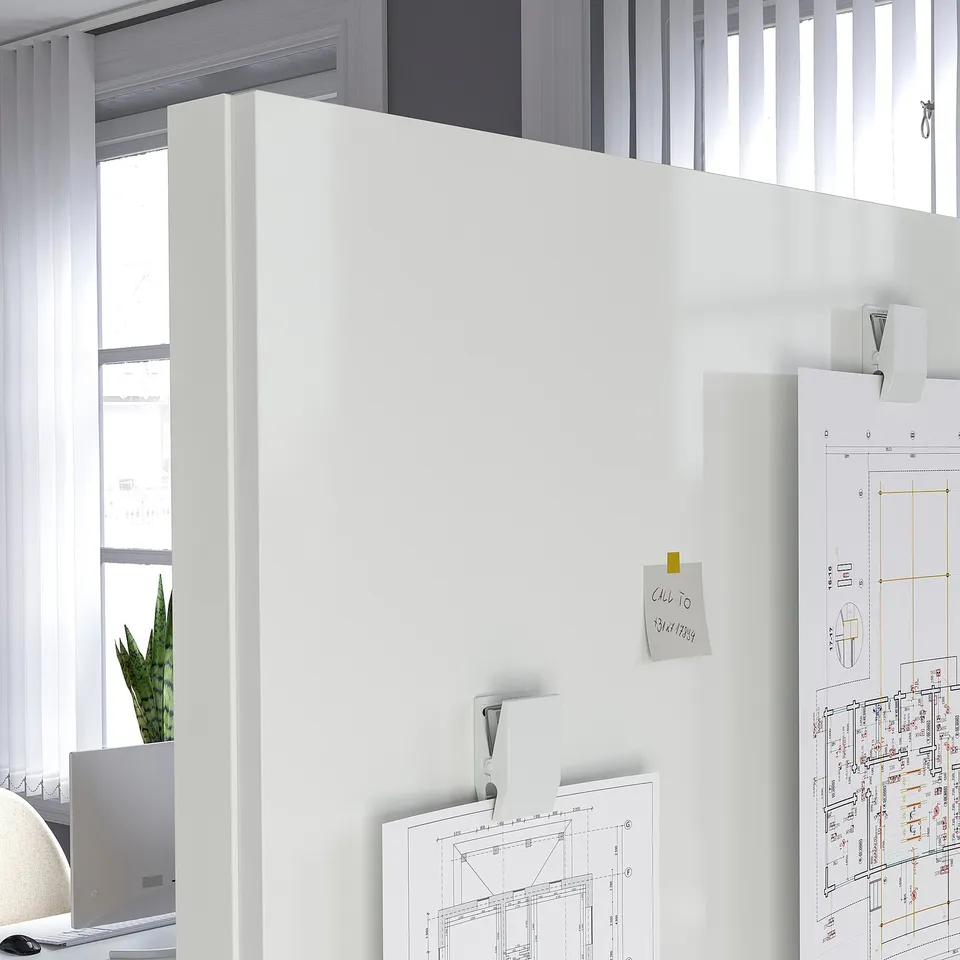 Office space divided by MITTZON frames. Whiteboards and storage present.