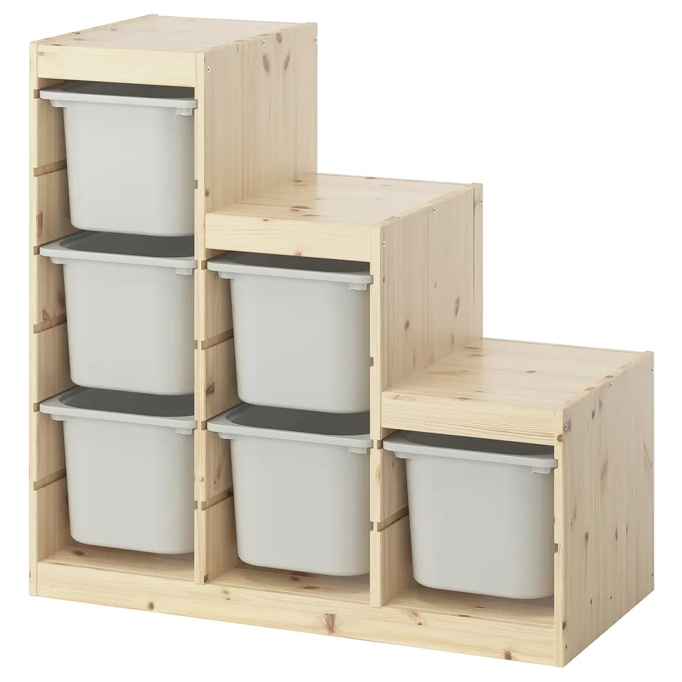 IKEAs TROFAST storage, light wooden frame with white storage bins, designed for childrens toys.