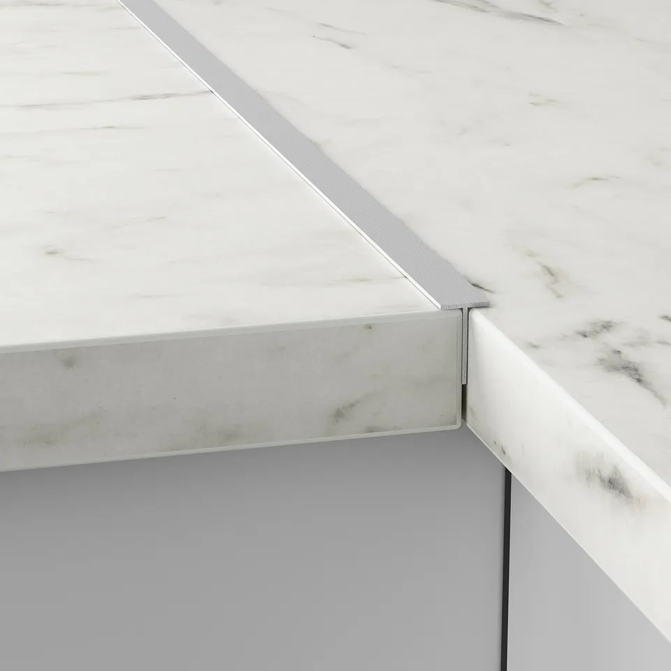 Marble countertop with metal edge support, FIXA visible.