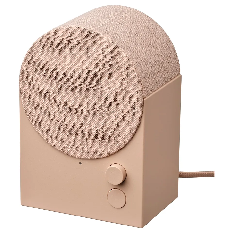 Peach-colored NATTBAD bluetooth speaker with woven fabric and controls.