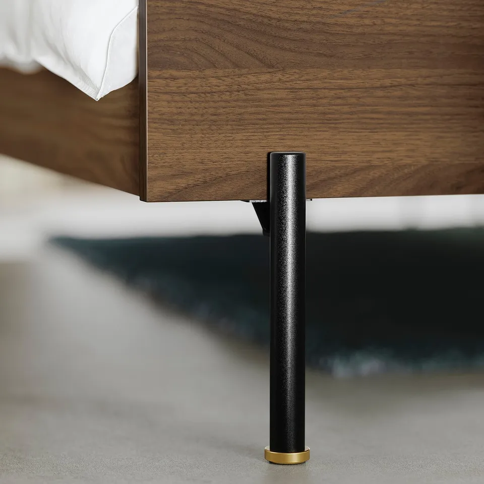 Mid-century inspired bed with sturdy walnut finish & black metal legs.