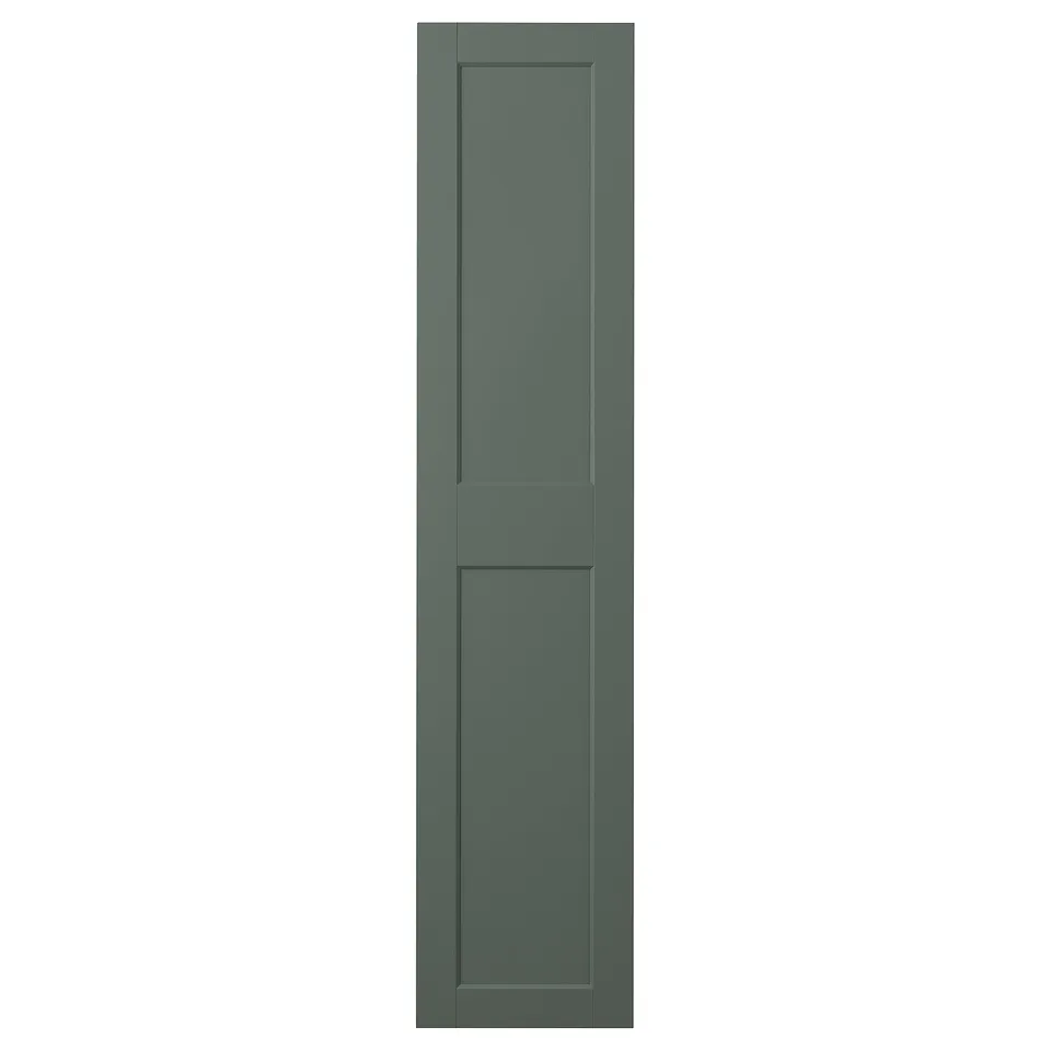 Modern green door with wide frames and bevelled edges