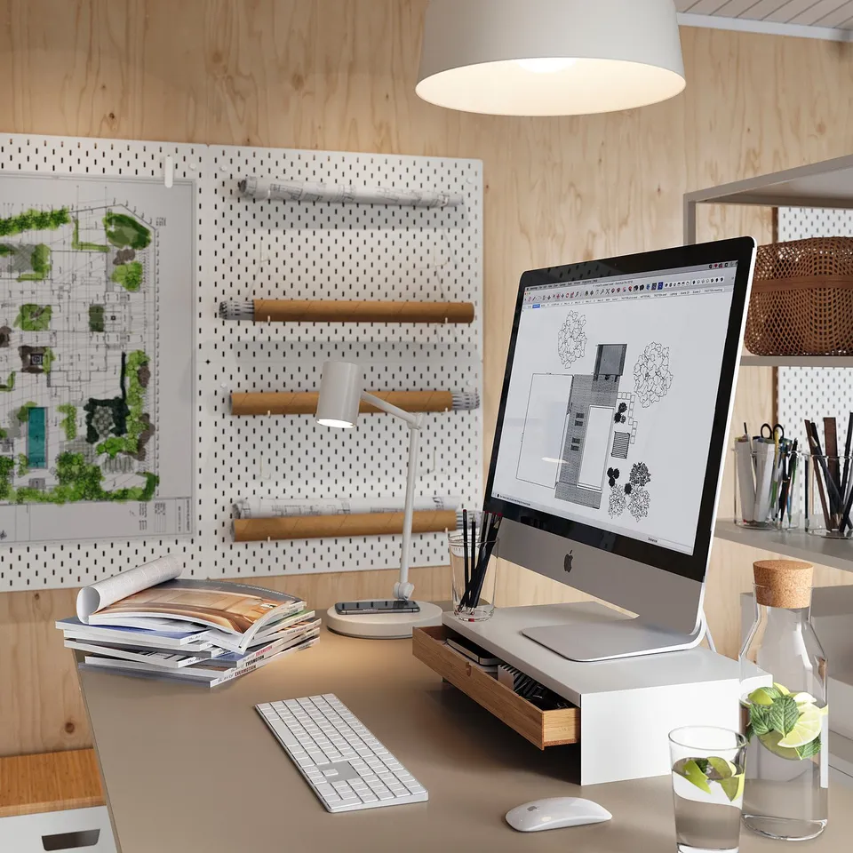 Home office: ELLOVEN stand, imac, peripherals, plant, lamp, books.