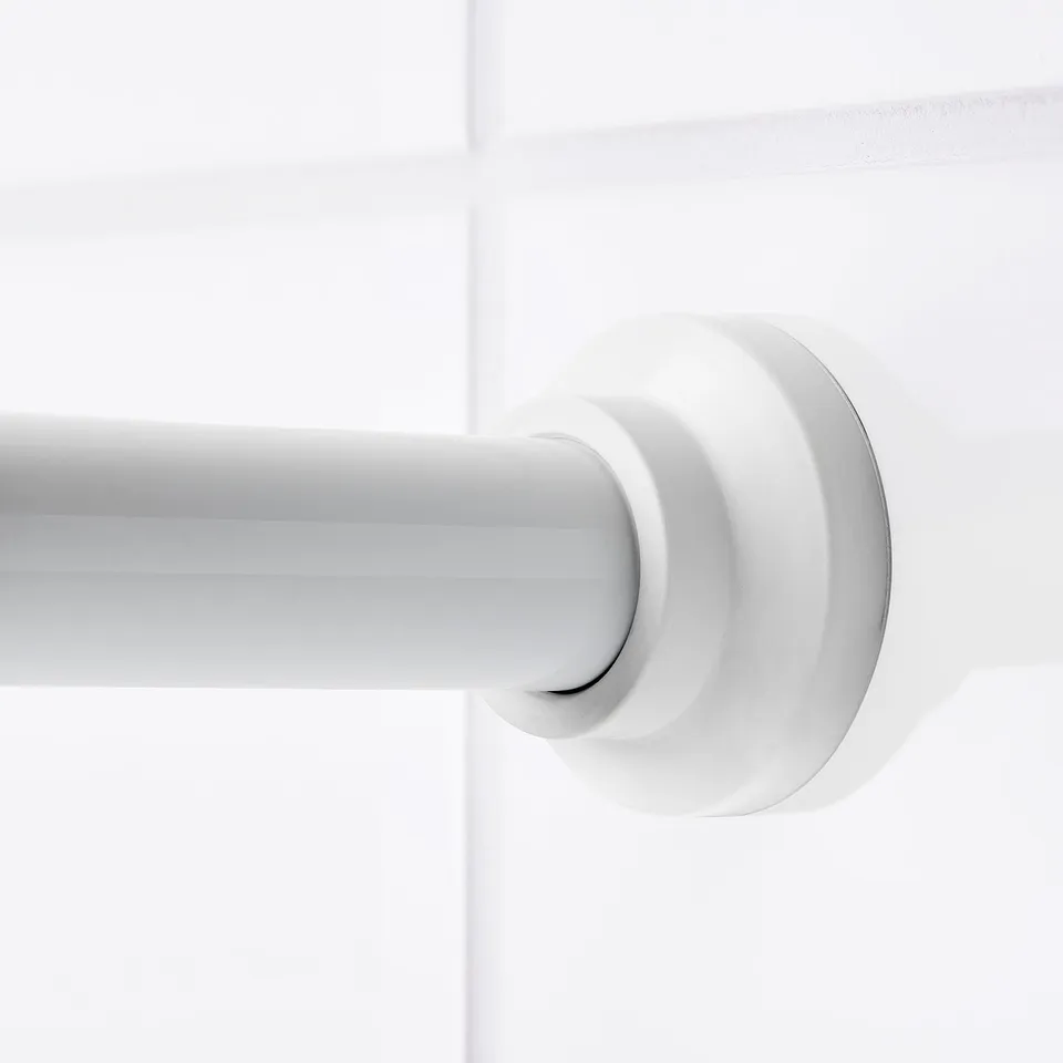 White shower curtain rod bracket, featuring modern design. Spring-loaded for secure wall mounting without screws.