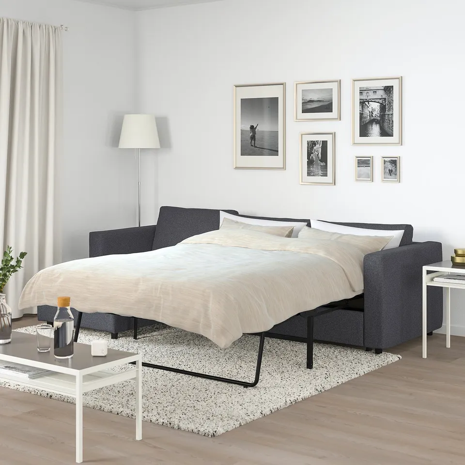 Modern grey VIMLE sofa-bed with beech finish, compact & roomy, includes chaise longue. Ideal for small rooms.
