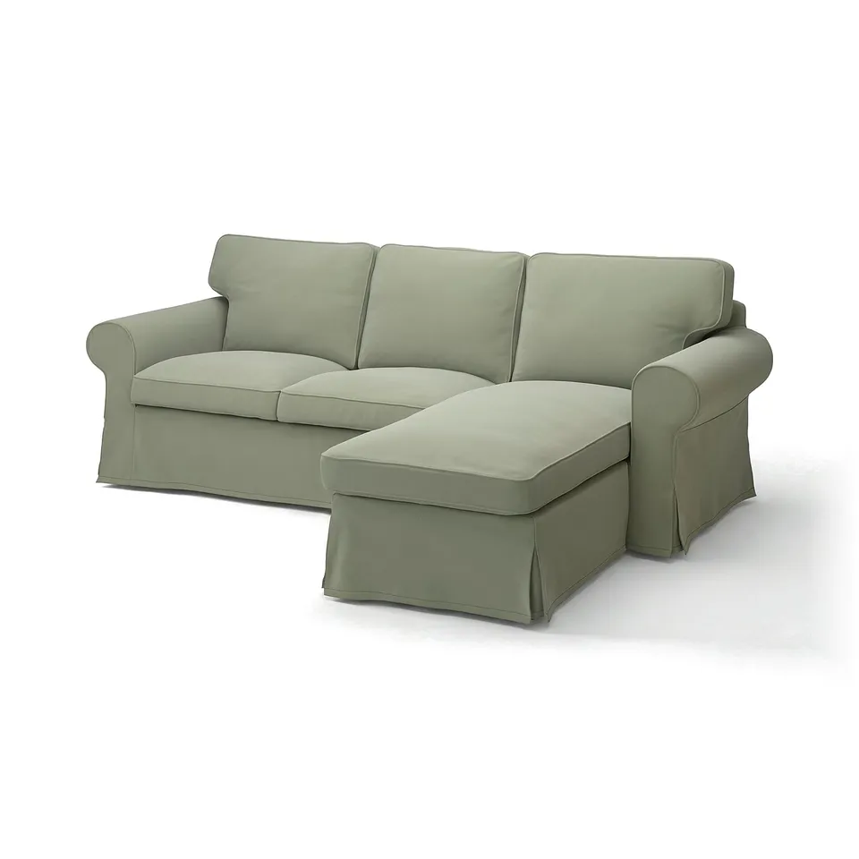 Modern light green sofa with attached chaise, rolled arms, and removable cover.