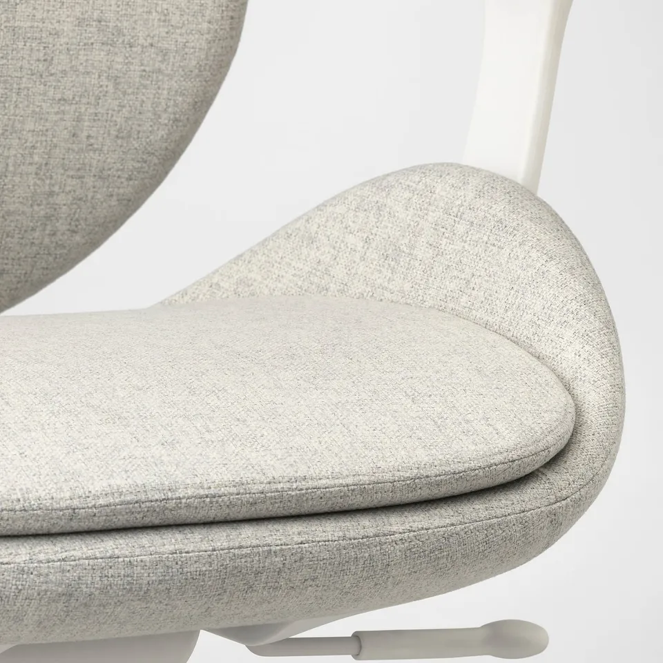 Close-up of modern, ergonomic office chair with sleek, light fabric, curved seat, and supportive backrest.