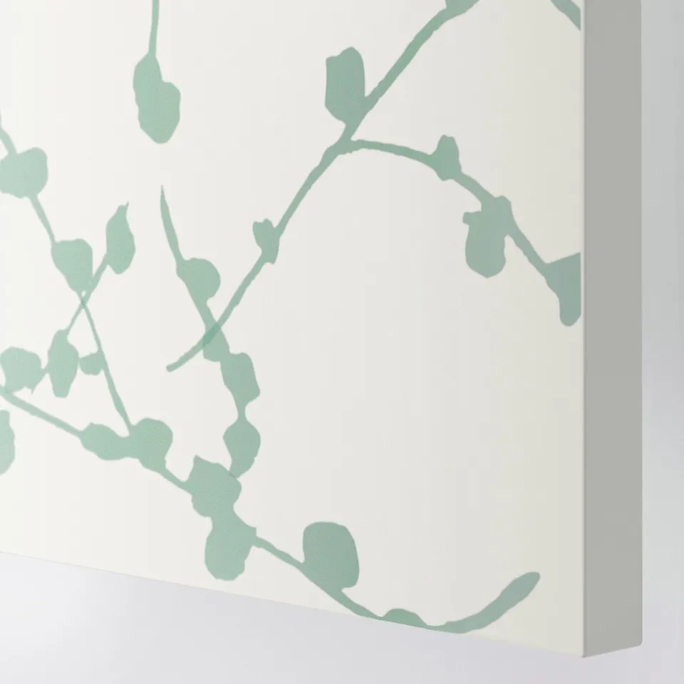 Minimalist green branch design on white door.