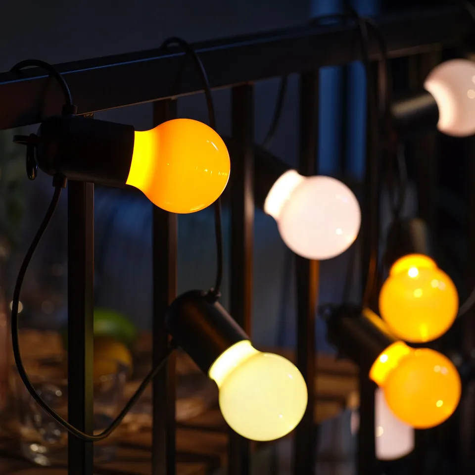 String of orange lights; perfect for outdoor spaces.