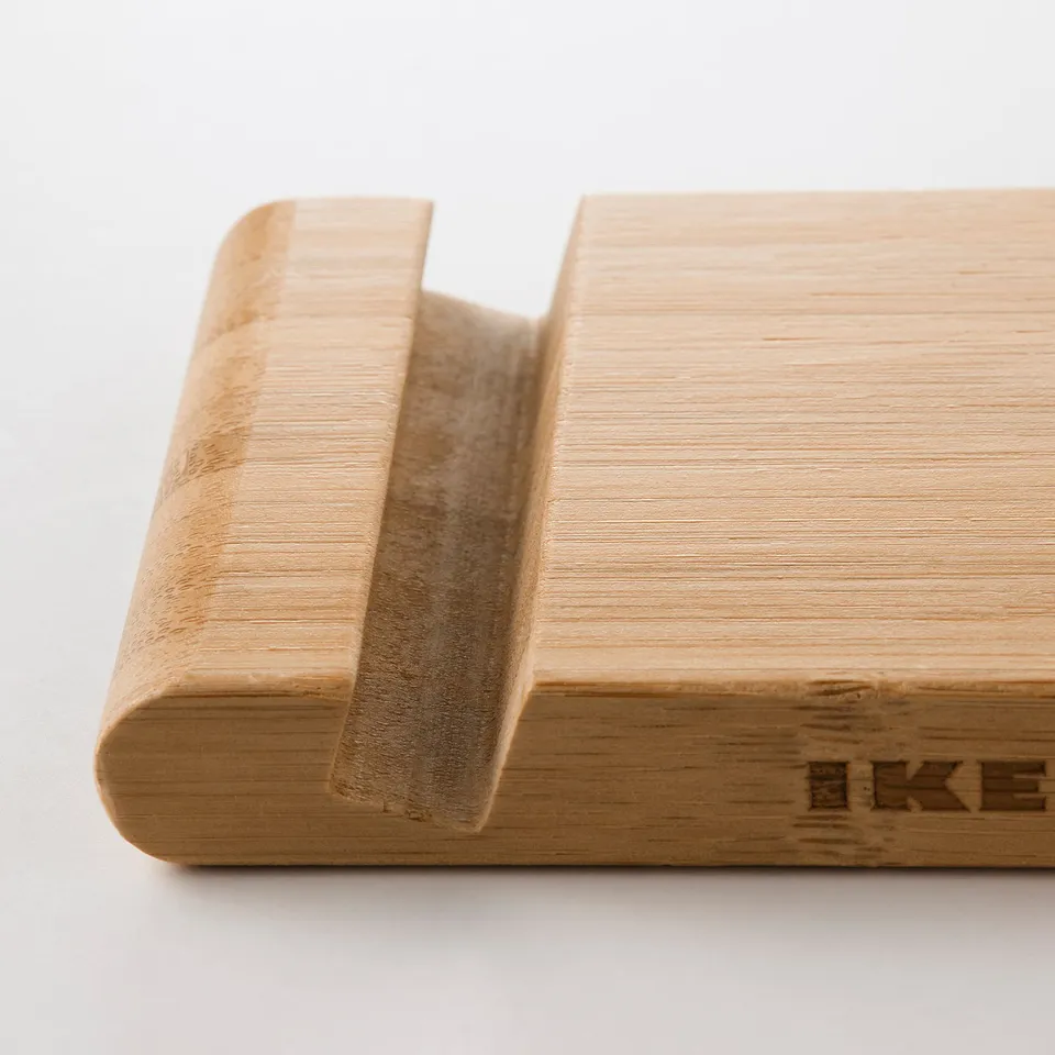 Bamboo holder for devices, sleek and sturdy, with two slots for secure placement.