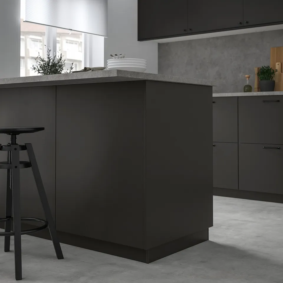 Modern matt black kitchen island with FÖRBÄTTRA panel, sleek design.