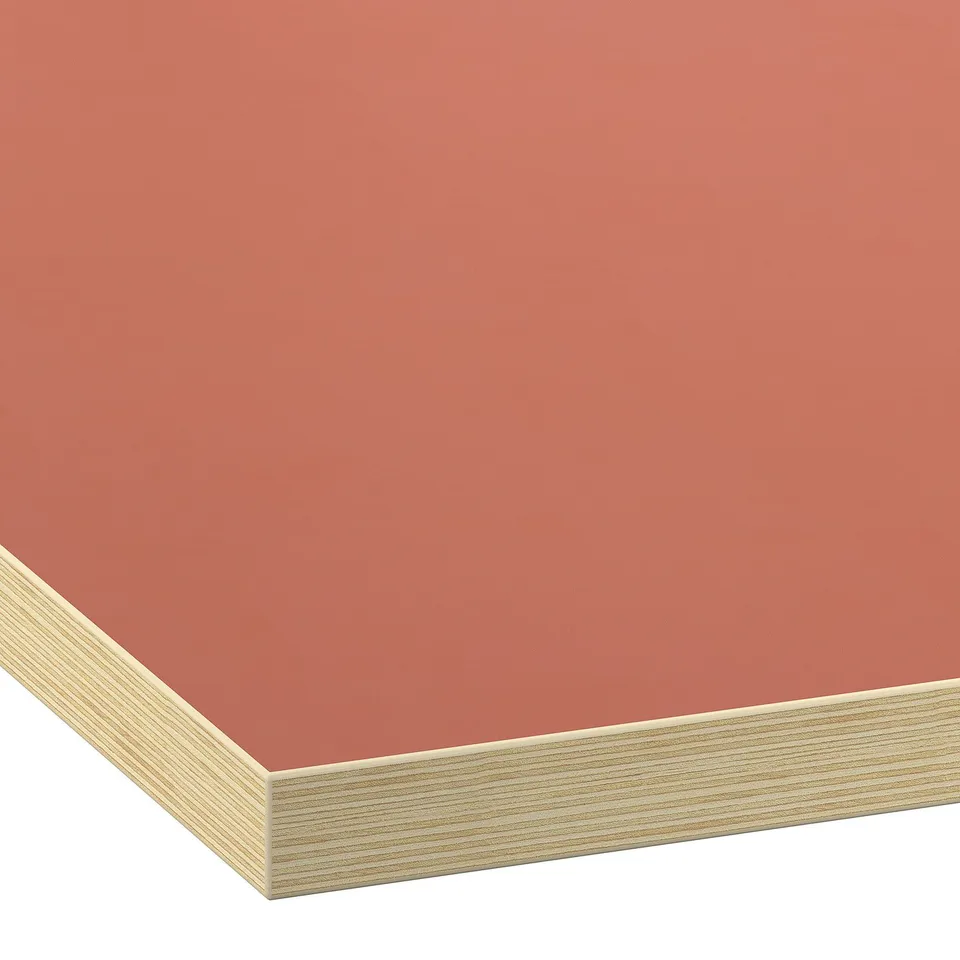Smooth, modern laminate worktop in vibrant orange with clean edges, perfect for a sleek kitchen.