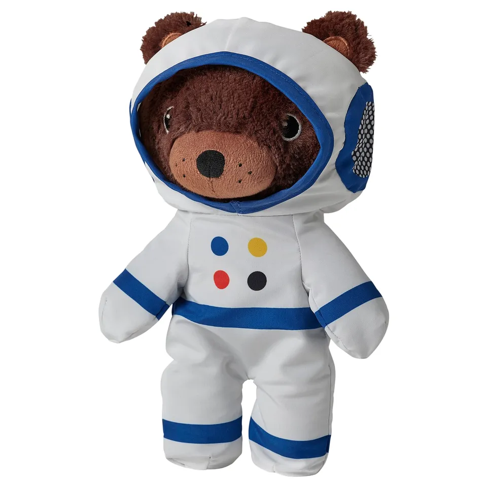 Brown bear in white, blue astronaut suit; soft, recycled materials.