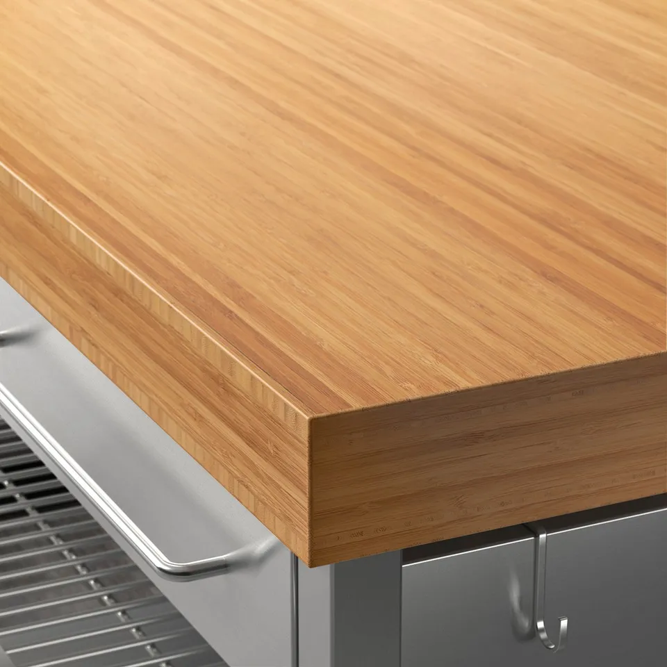 Sleek bamboo countertop, smooth finish, seamless joints, part of sturdy kitchen island.