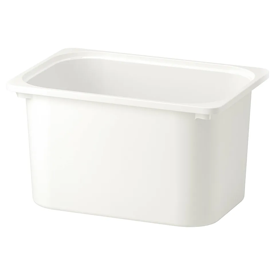 White TROFAST storage bin, rectangular, plastic, for organising kids items.