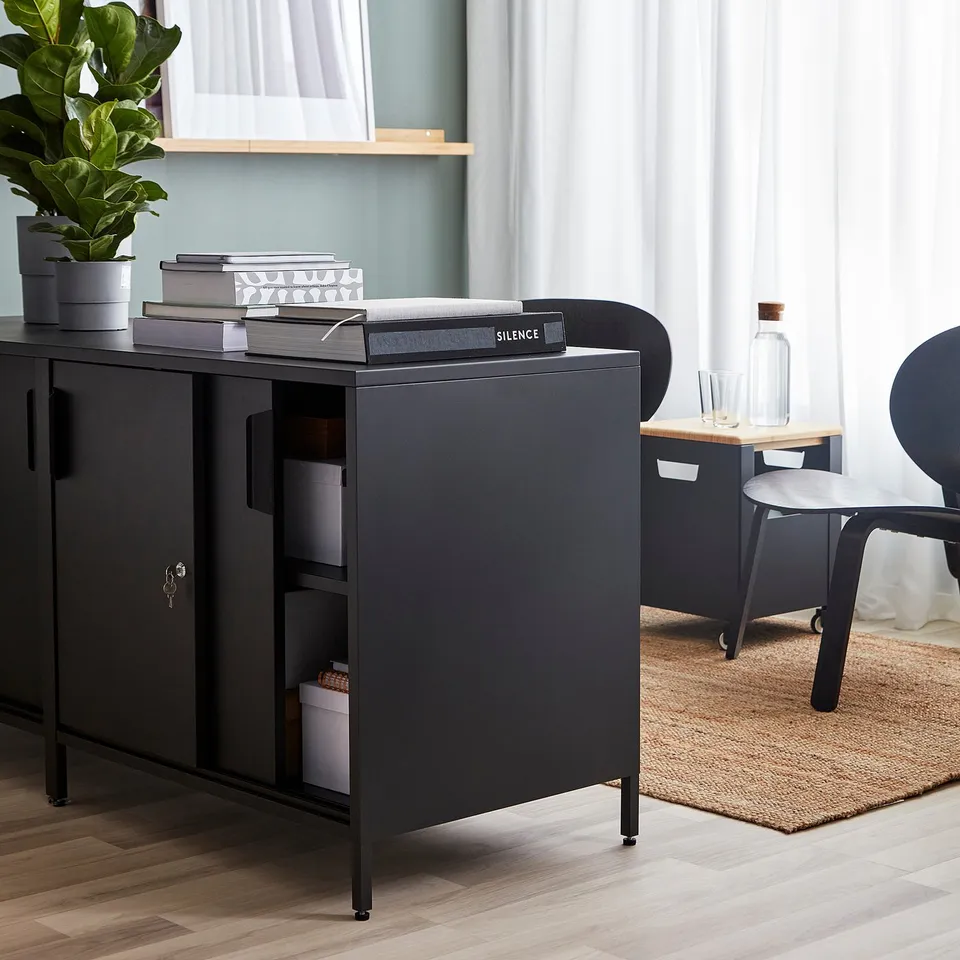 Modern office with TROTTEN lockable cabinet and chair.