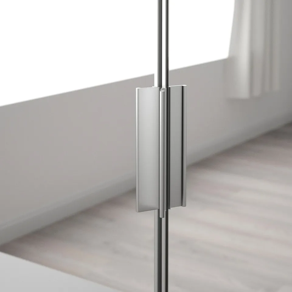 Modern, sleek mirrored cabinet door with sturdy metal handle.