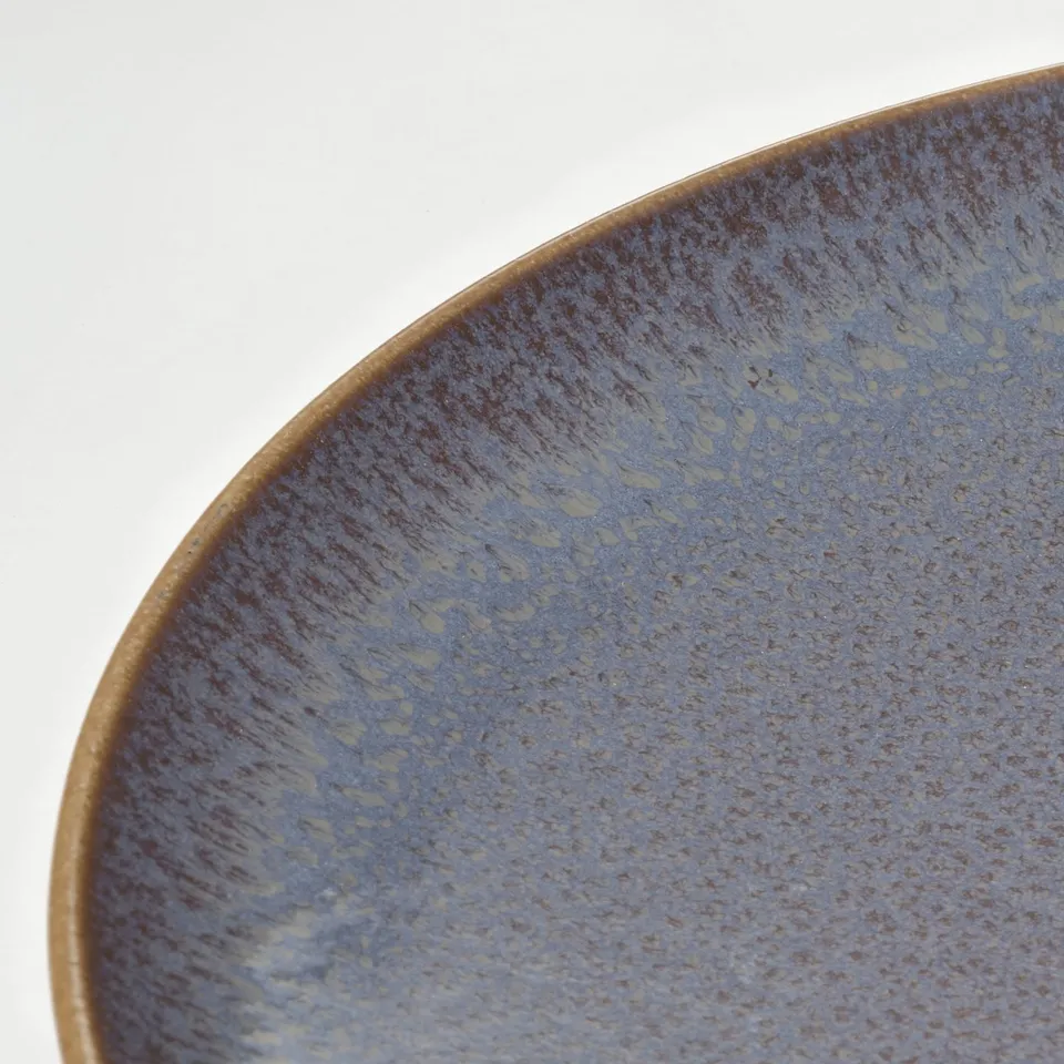 Blue dish, textured.
