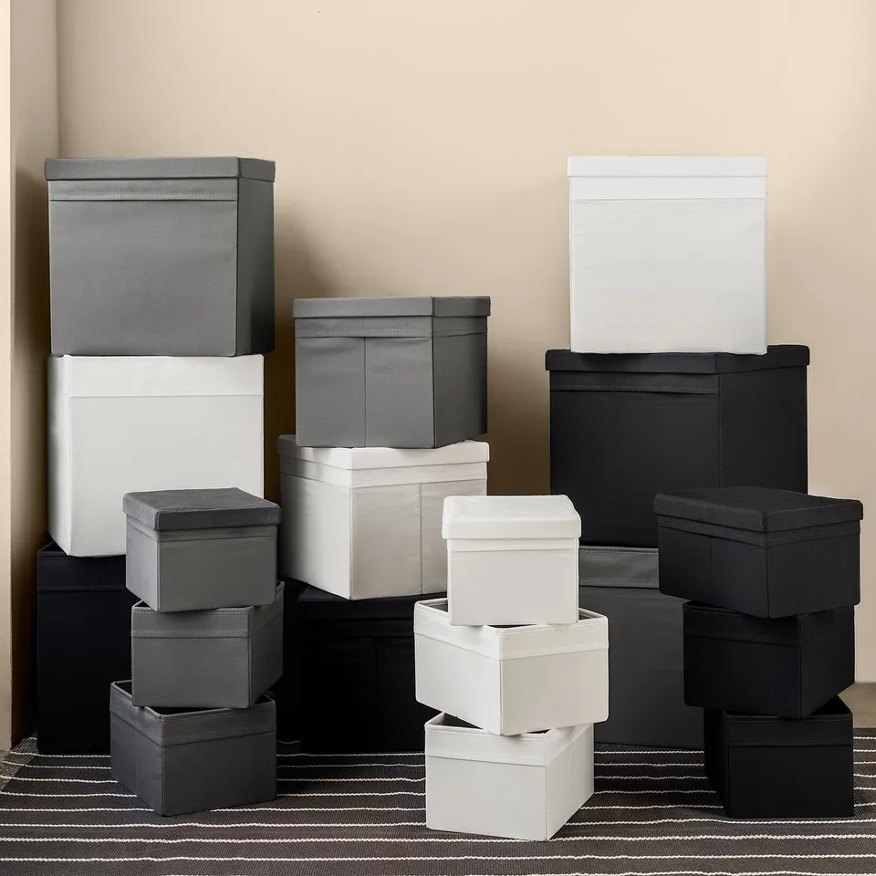 Stacked fabric storage boxes, in grey and white, with lids, designed for use with billy bookcase.
