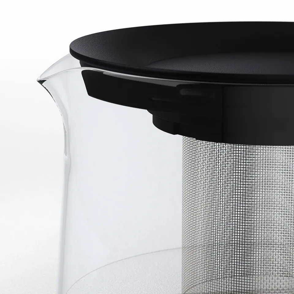Clear glass teapot with black lid and mesh infuser, high-quality design for perfect tea brewing.