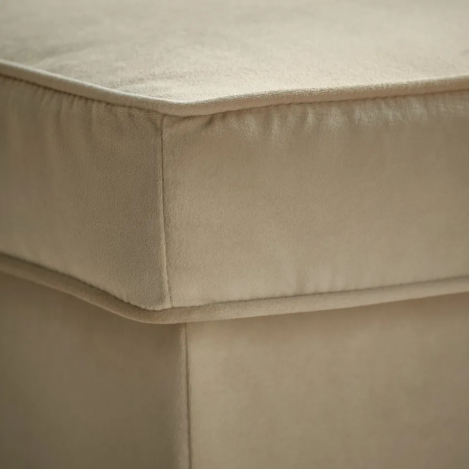 Close-up of beige STRANDMON chair, soft fabric, neat stitching, high-quality cushioning.