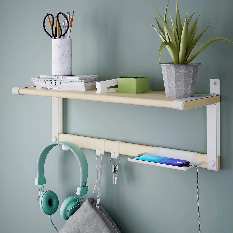 Wall shelf with hooks, holding keys, phone, headphones, and plant.