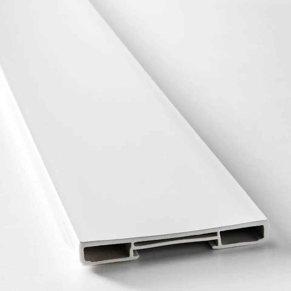 Close-up of white plastic plinth. Sleek, smooth surface and sturdy build, designed for kitchen cabinetry.