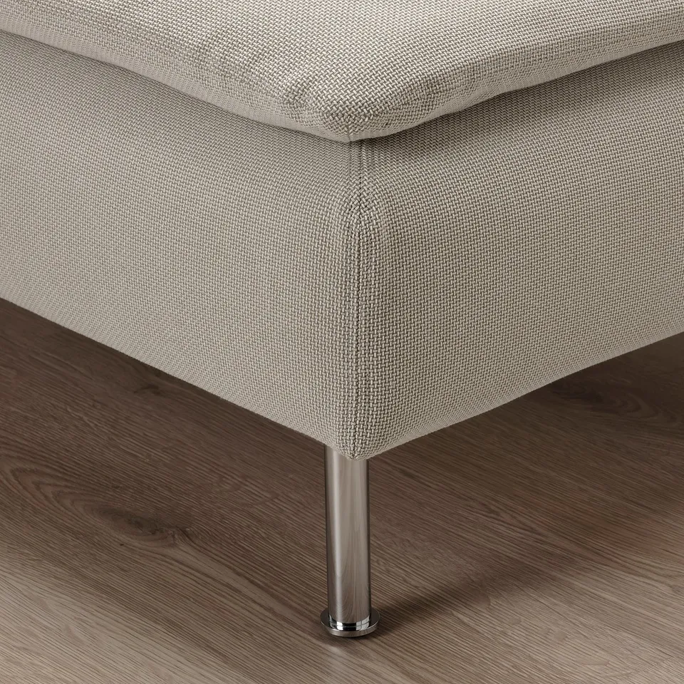 Modern sofa corner, light grey fabric, chrome-plated legs, low profile.